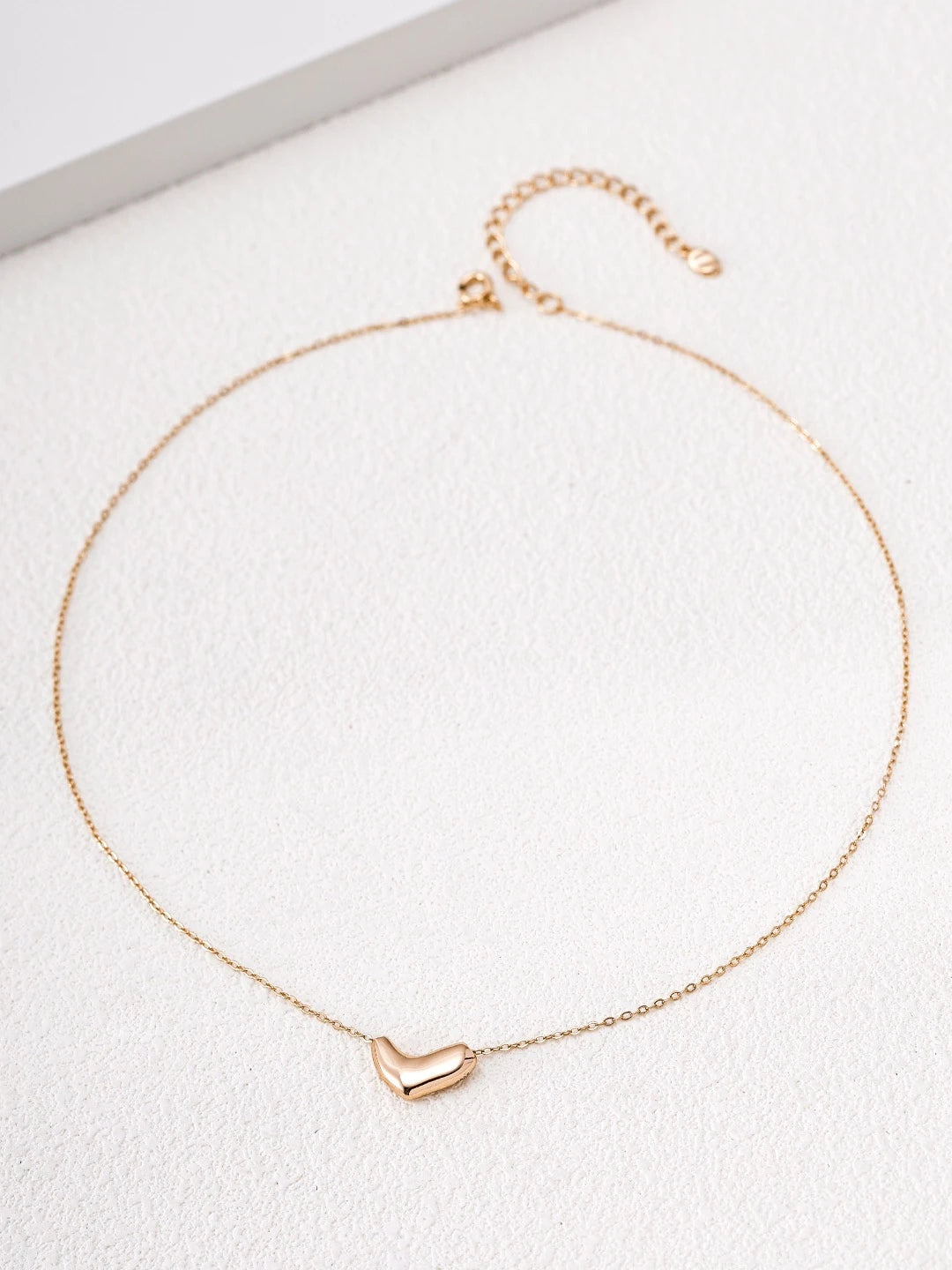 Gold-plated S925 sterling silver Amour Heart Necklace with a sculpted heart pendant and delicate adjustable chain.
