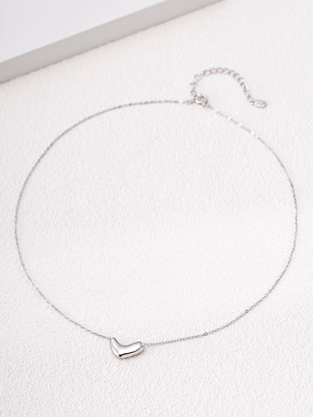 S925 sterling silver Amour Heart Necklace with a sculpted heart pendant and delicate adjustable chain.