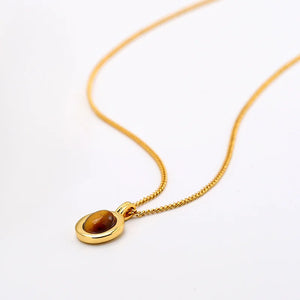 Elegant gold chain necklace with warm Tiger’s Eye pendant gemstone charm.
