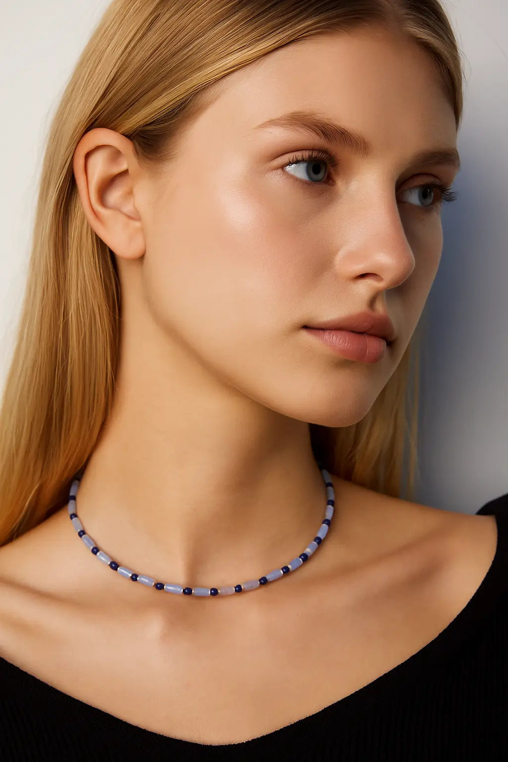 Model wearing Ancient Lapis Lazuli Celeste Choker Necklace with blue and gold bead accents