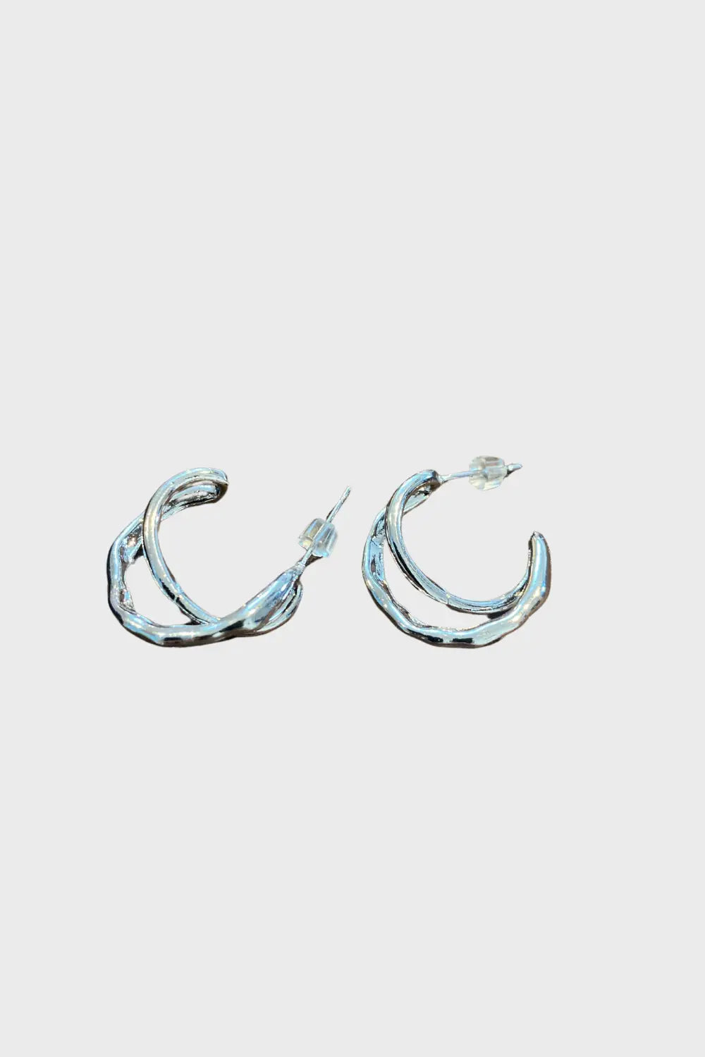 Anaïs & Aimee sleek C-Cross sterling silver earrings on clean background, minimalist design