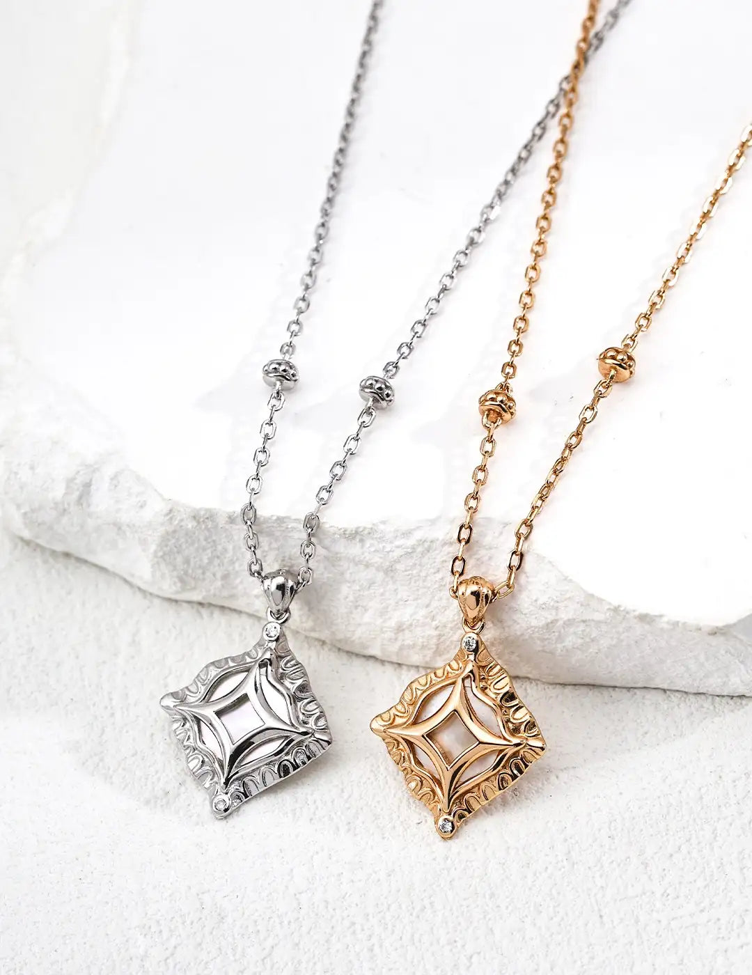 Haslemere square pendant necklace in vintage gold and white gold with mother of pearl centre and zircon detail on adjustable chain.