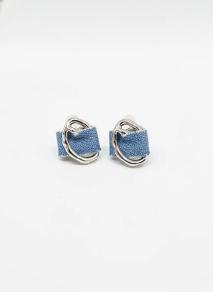 Pair of denim hoop earrings on a white background