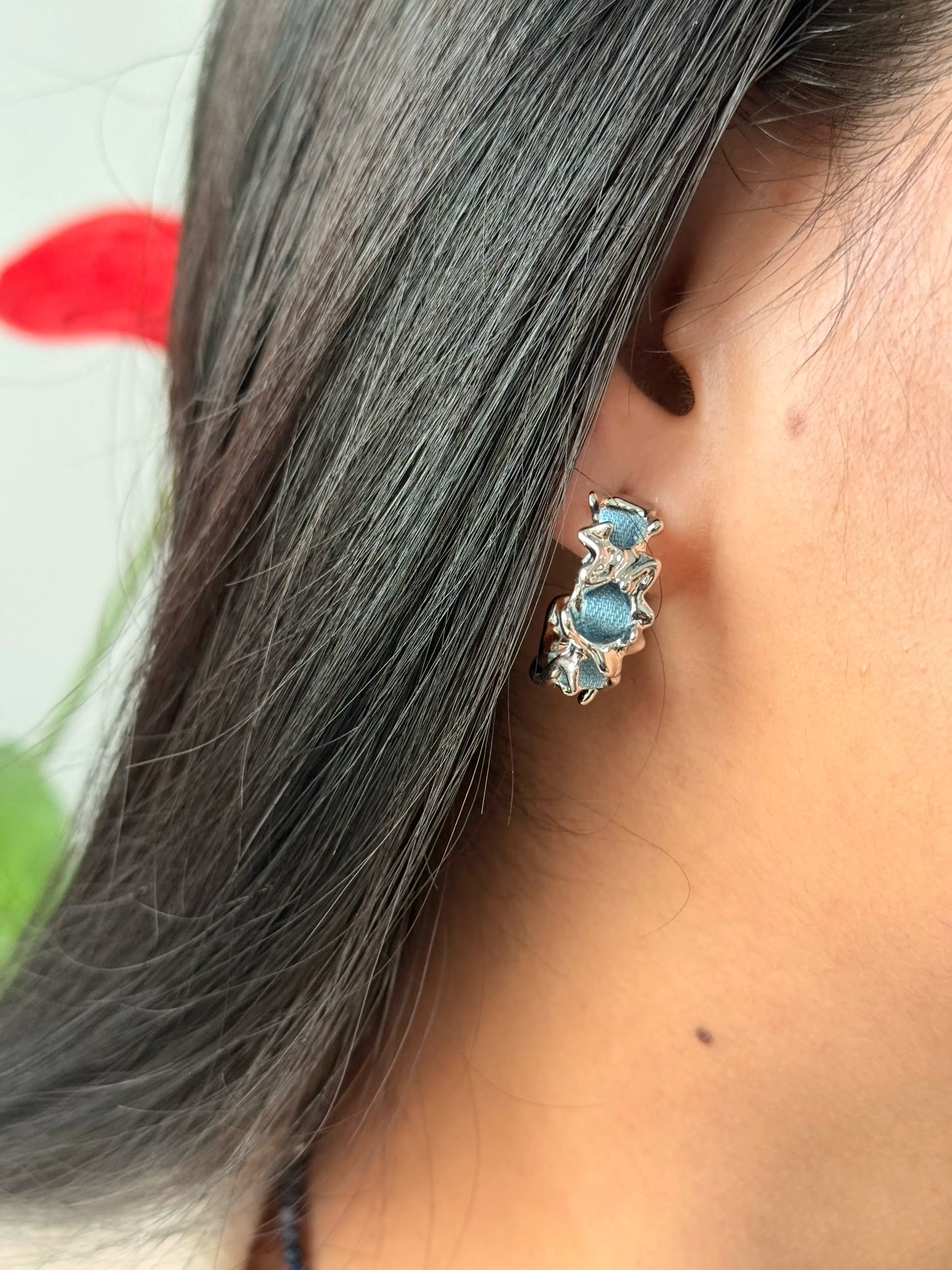 Model wearing textured silver hoop earrings – Denim Moon, UK jewellery