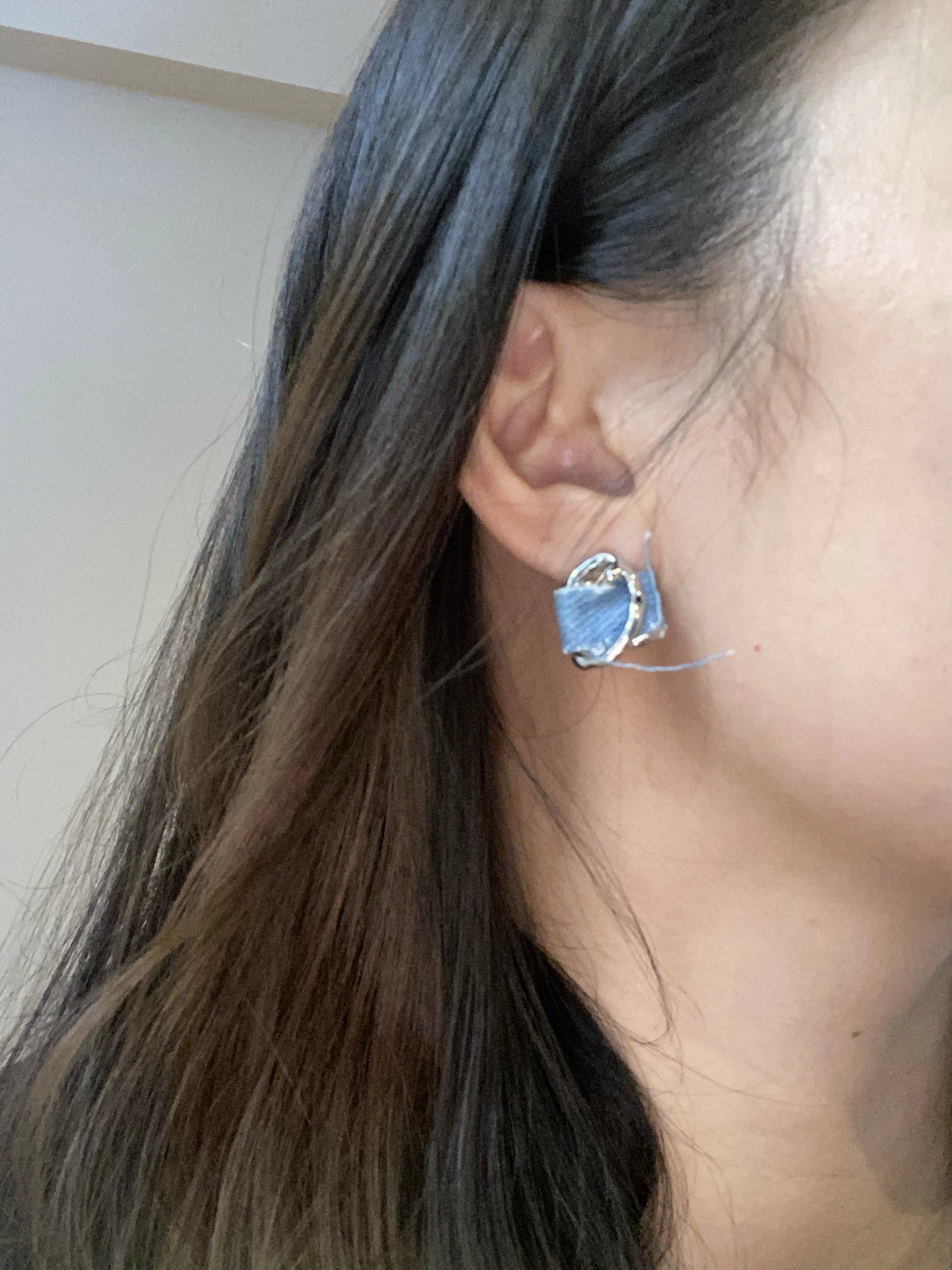 Anais&Aimee Denim Angel Silver Statement Earrings 45-degree angled photo