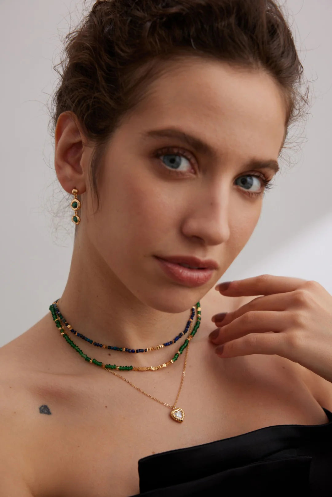 Radiant Emerald Green Choker with gold stones by Anaïs & Aimee, paired with matching earrings