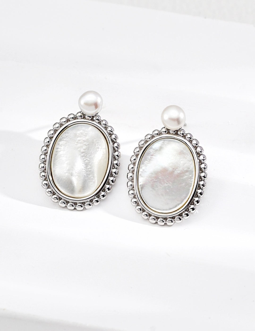 Vintage gold pearl earrings with mother of pearl centre