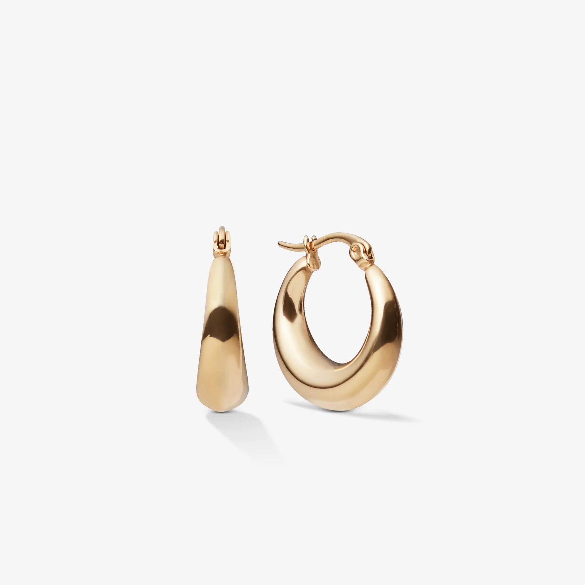 Gold hoop earrings on a white background