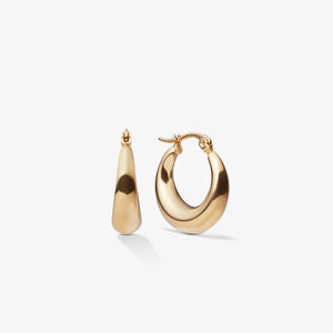 Gold hoop earrings on a white background