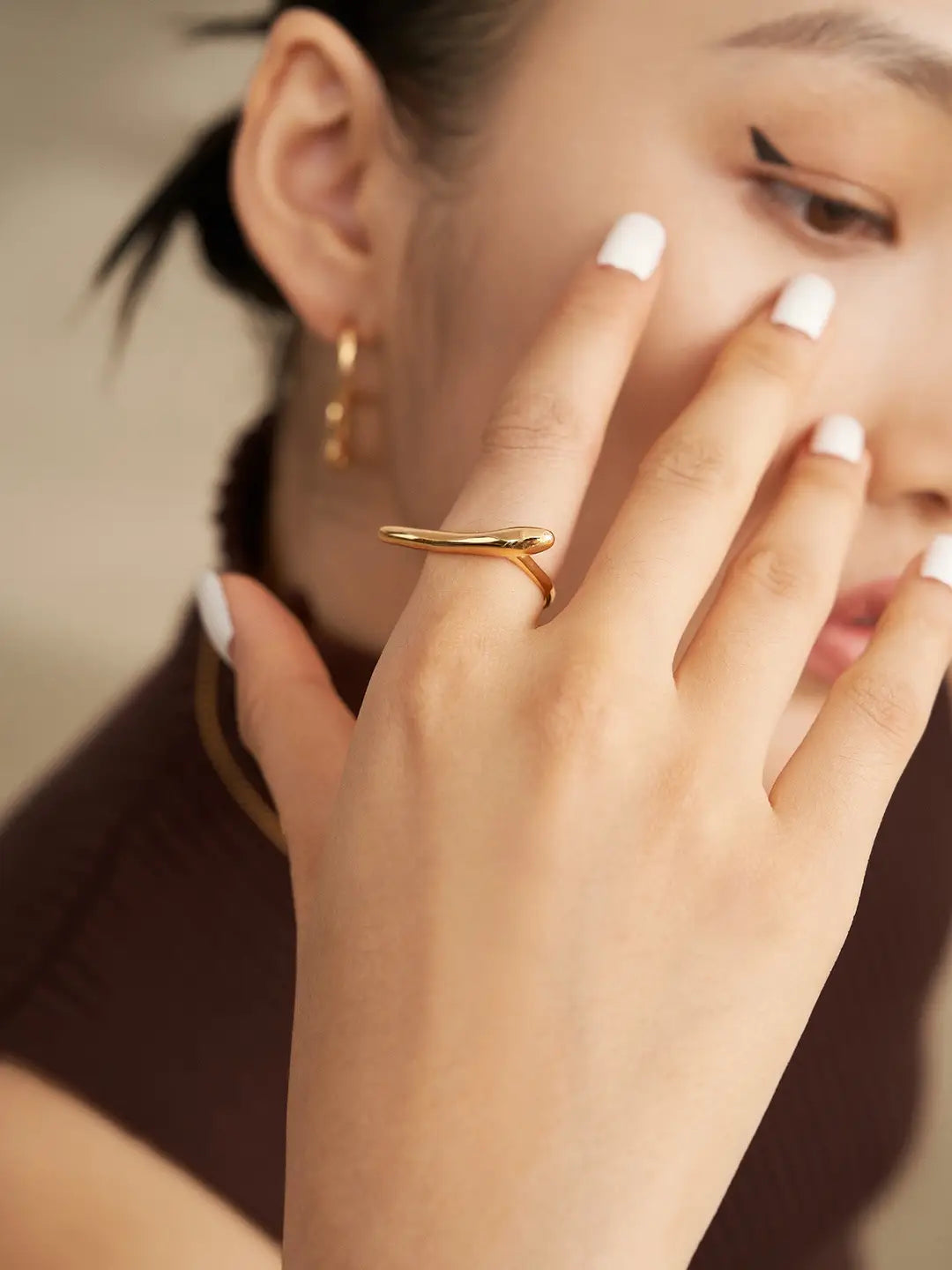 close up Gold adjustable sterling silver statement ring on hand – minimalist ring UK