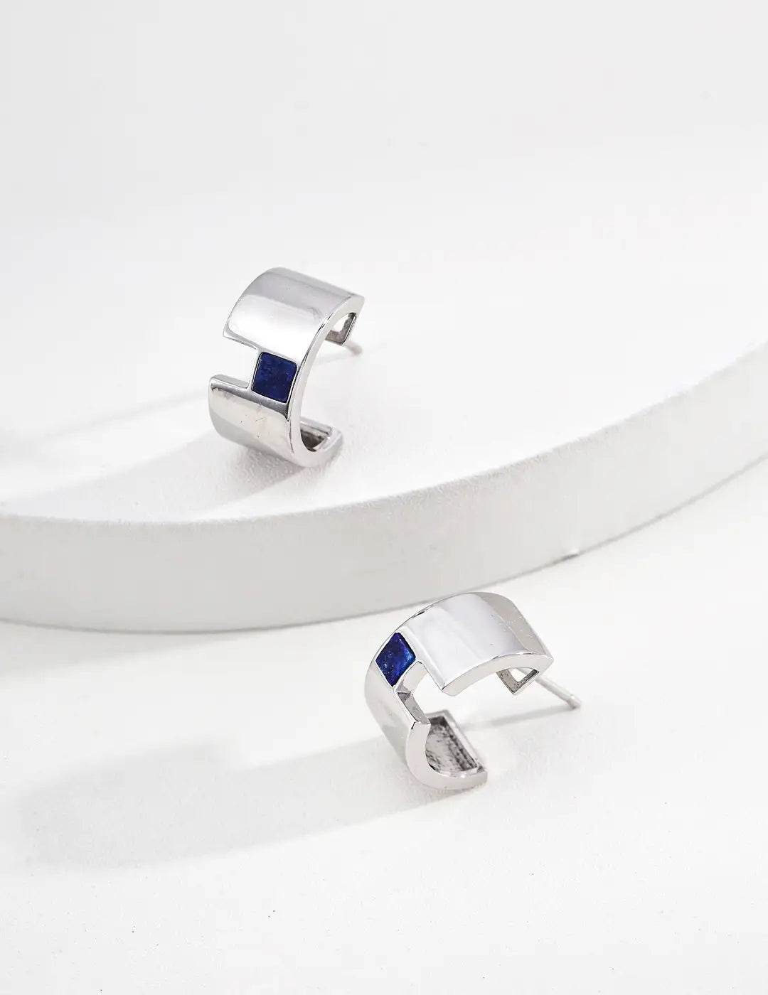 Contemporary silver earrings with blue lapis stone detail – modern minimalist gemstone earrings UK.