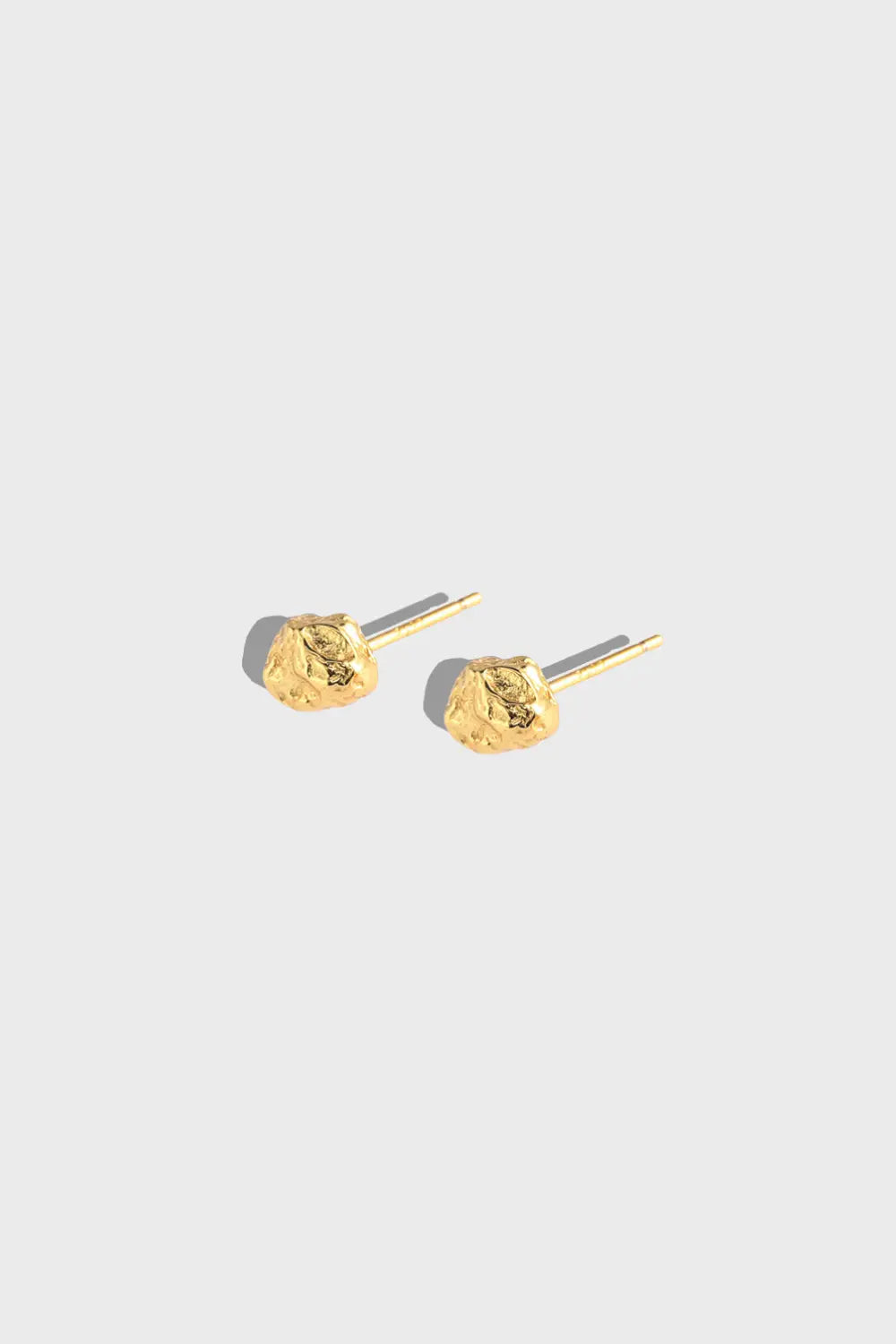 Gold-plated stud earrings with raw crinkled tin foil texture for edgy elegance