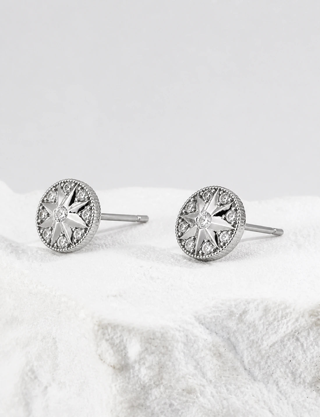 Didcot sterling silver stud earrings in side profile, showing the round settings and straight posts