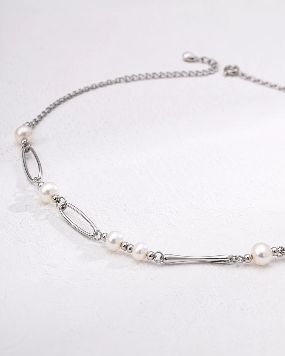 Kingsbury freshwater pearl chain necklace in polished sterling silver, low front view