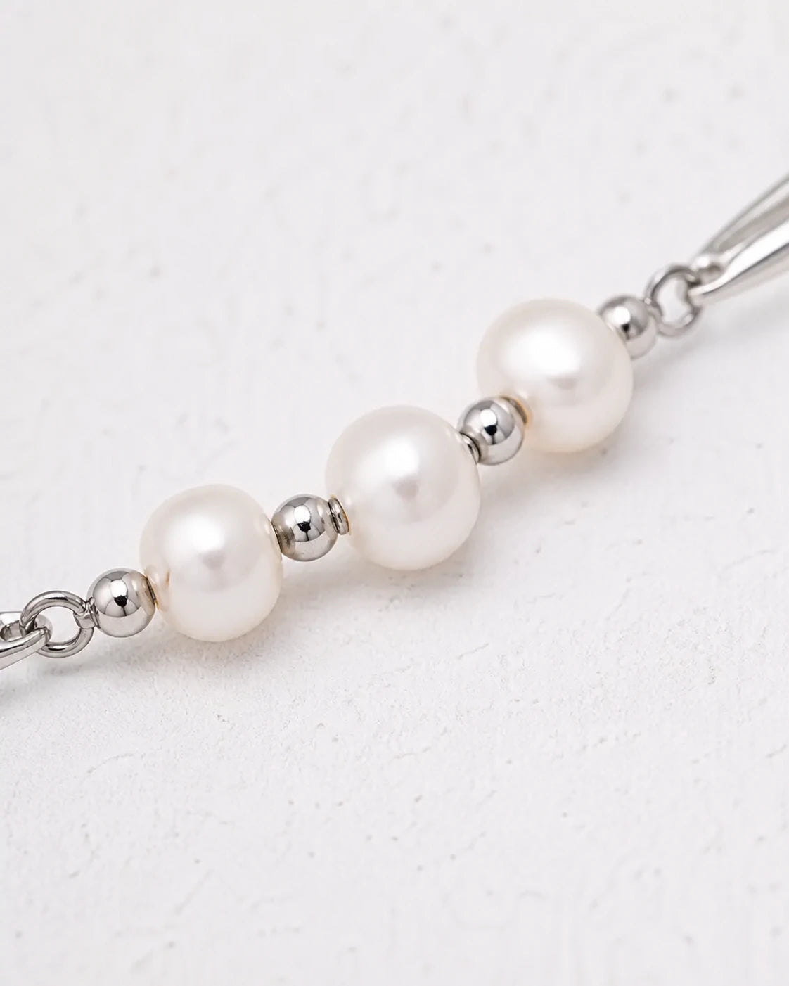 Dainty silver pearl necklace with white freshwater pearls and polished spacer beads