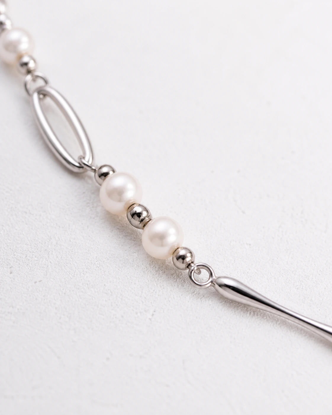 White freshwater pearls with sterling silver spacer beads on Kingsbury necklace